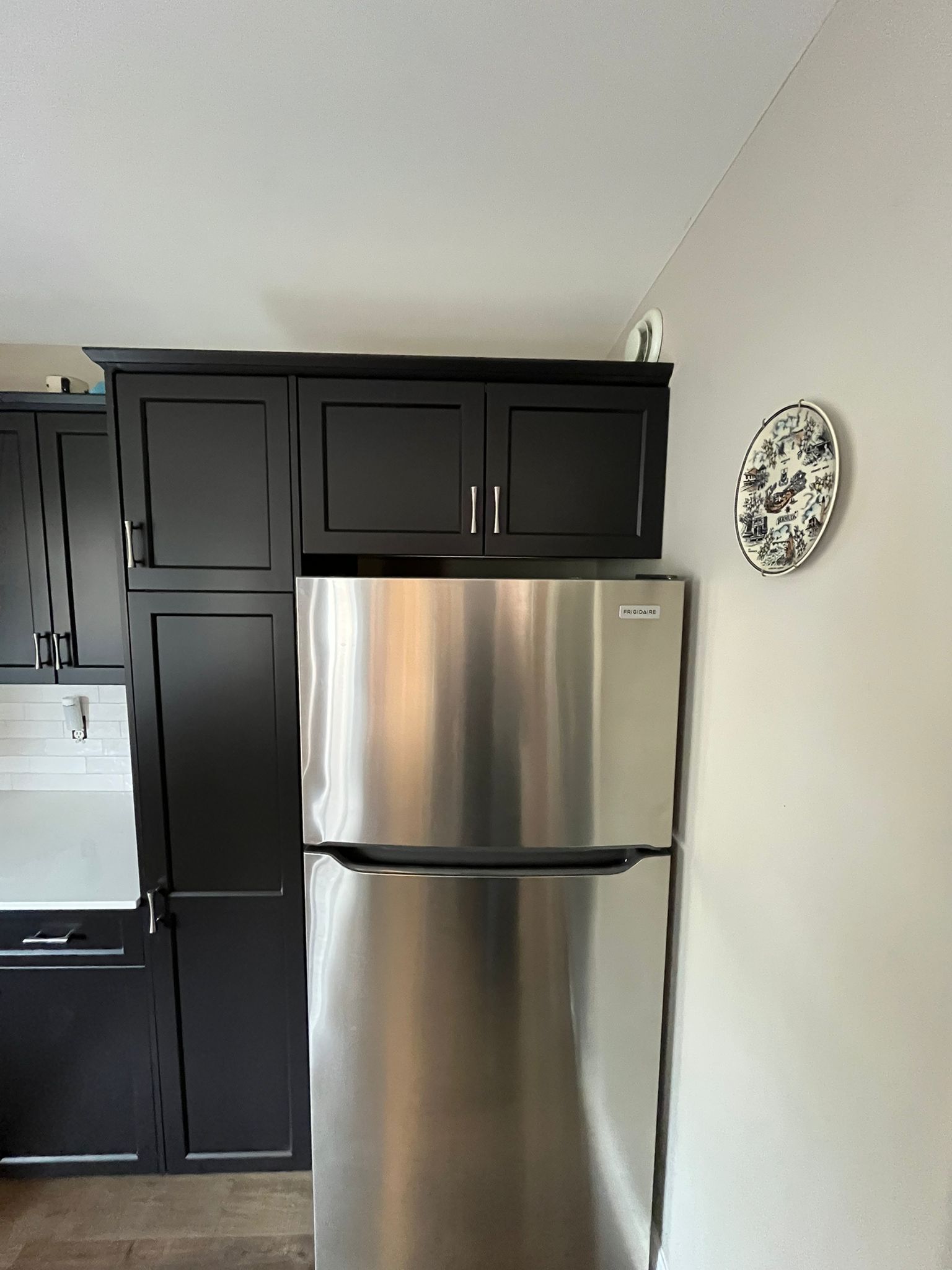 Cabinet surfaces being cleaned and degreased